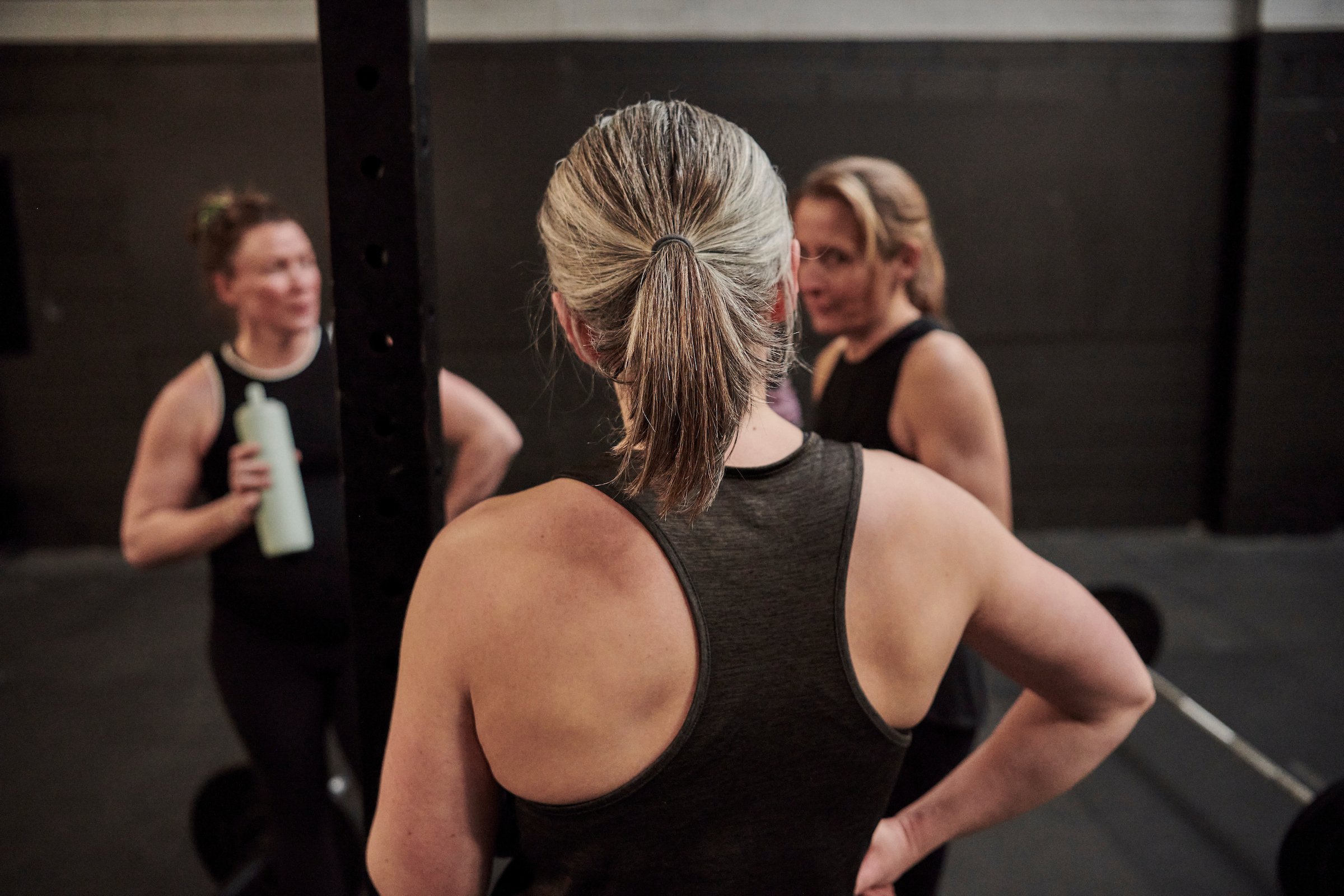 middle aged woman in gym, peri-menopause training, group of women